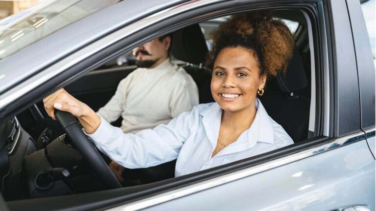 1 The double edged sword of insurance tracking programs smiling woman in car