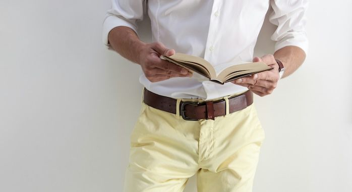 man holding book.jpg.optimal