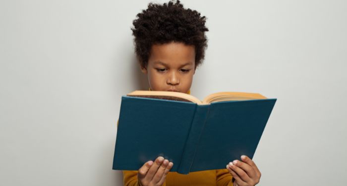 boy reading book.jpg.optimal