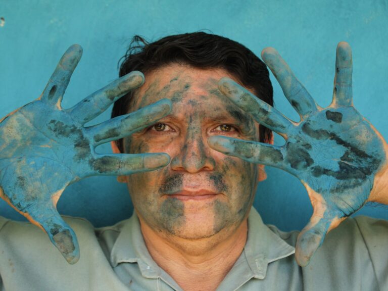 Luis May Ku 49 poses with his hands painted in Maya Blue outside his home in Dzan Yucatan Mexico on 9 September 2024 1731943152